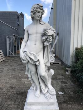 Prachtig tuinbeeld van Bacchus, vol steen